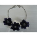SILVER TONED NECKLACE WITH BLUE FLOWERS
