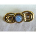 GOLD TONED BROOCH WITH SEMI PRECIOUS STONE STAMPED