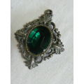 SILVER TONED PENDANT WITH GREEN GLASS STONE
