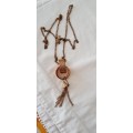 Bronzy coppery unusual but pretty long necklace