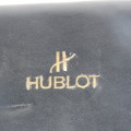Vinyl watch case with Hublot logo