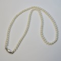 Vintage string of pearls with sterling silver clasp