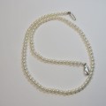 Vintage string of pearls with sterling silver clasp