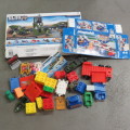 Large lot of assorted building blocks - Lego Duplo, Mega blocks, Playmobil - Plastic bin included