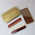 Vintage slide top brush with mirror and combs
