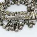 Low Grade silver bracelet with bells - weighs 107.7grams - lenght 23cm - one link broken