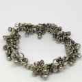 Low Grade silver bracelet with bells - weighs 107.7grams - lenght 23cm - one link broken