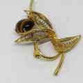 Gold colored fashion jewellery tigers eye brooch