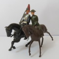 Pair of vintage cavalry troops lead soldiers