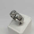 18kt White gold diamond ring with 1.2ct diamond and 2 smaller diamonds of 0.40ct -  weighs 7.0 grams