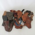 Lot of 10 leather holsters and straps for .32 and .38 revolvers