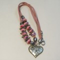Costume jewellery pink necklace with cross pendant