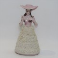 Antique small porcelain doll with material clothes