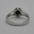 9kt White gold ring with black diamond of over 1 ct plus 60 small diamonds - Size N