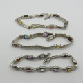Lot of 3 silver look alike bracelets with colored stones - never used