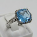 9kt Gold ring with blue Topaz and small diamonds of 0.13ct - weighs 3.5g - size N/7 - new never worn
