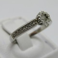 9kt White Gold diamond ring with 0.10ct diamond and smaller 0.15ct in total - weighs 2.2g - size L/6