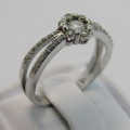 9kt White gold diamond ring with 0.11ct diamond and small diamonds of 0.25ct in total