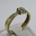 9kt gold ring with 14 small diamonds of about 0.25ct in total - weighs 2.9g - size Q/8