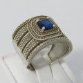 Sterling Silver ring with blue stone - weighs 7.5g - size Q/8