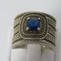 Sterling Silver ring with blue stone - weighs 7.5g - size Q/8