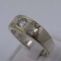 Sterling Silver ring with clear stones - weighs 8.8 grams - size Z/13