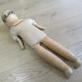 Antique Composition doll with soft body and legs - Some damage to fingers and head - Length 64 cm