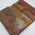 Vintage leather wallet with Africa map motif
