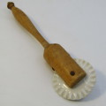 Antique porcelain and wood pastry rim roller