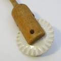 Antique porcelain and wood pastry rim roller