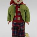 Vintage mechanical clown toy that shakes when winded up