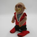 Vintage mechanical monkey toy that does back flips