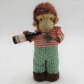 Vintage mechanical monkey toy - pouring a Vintage mechanical monkey toy