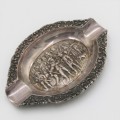 Silver ashtray with Musketeer theme in centre