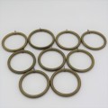 Lot of 9 vintage brass curtain rings