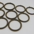 Lot of 9 vintage brass curtain rings