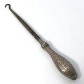 Boot lace puller with silver handle