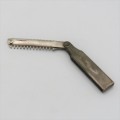 Vintage fold open travel razor