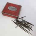 Lot of 22 leather making needles on vintage Craven-A tin