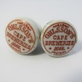 Pair of vintage Ohlssons Cape Breweries - K Hutte porcelain bottle lids