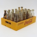 Vintage miniature Coca-Cola bottles in yellow tray - Two Coke bottles missing and was replaced
