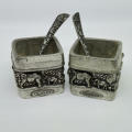 Pair of Andy C salt holders with spoons