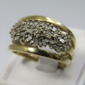 18k Gold ring with 22 baquette diamonds and 24 small round diamonds - weighs 6,1g - size M