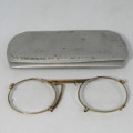 Antique gold coloured spectacle glasses in case