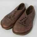 Pair of antique leather boys shoes