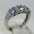 9kt white gold ring with 6 small diamonds and 6, iolites. Weight 3.5g , Size O