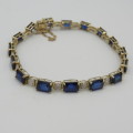 9kt bracelet with 10 diamonds and 16 rectangular blue sapphires ( not tested if natural)