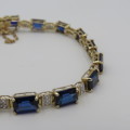 9kt bracelet with 10 diamonds and 16 rectangular blue sapphires ( not tested if natural)