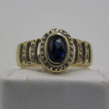 9 kt Gold ring with 12 Diamonds and centre stone dark blue ( Ring Size - K 1/2)