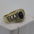 9 kt Gold ring with 12 Diamonds and centre stone dark blue ( Ring Size - K 1/2)